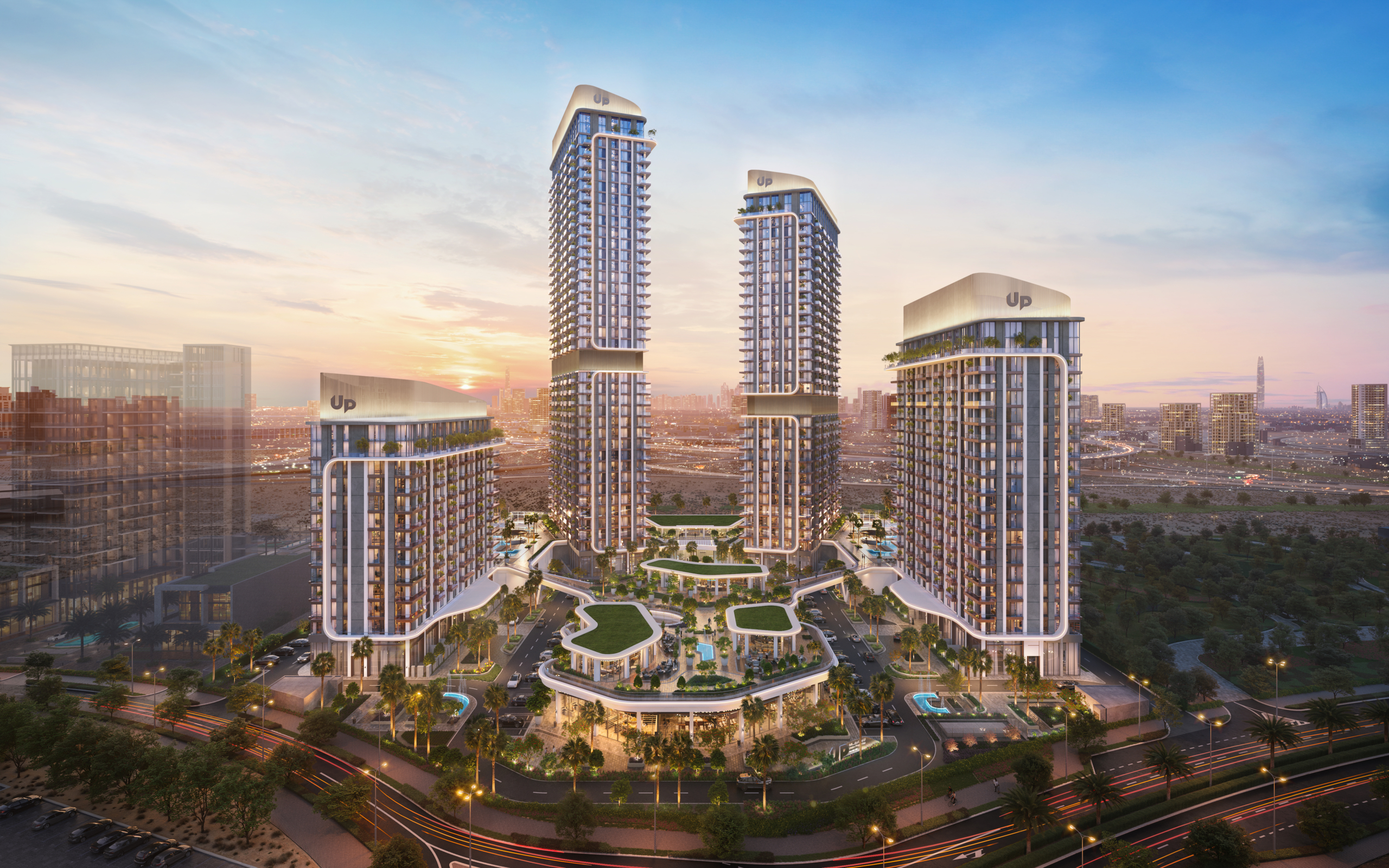 Mirdad by Union Properties towers and landscaped park at dusk