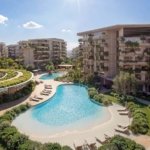 Arancia Yards lagoon pool and landscaped residential buildings by BEYOND