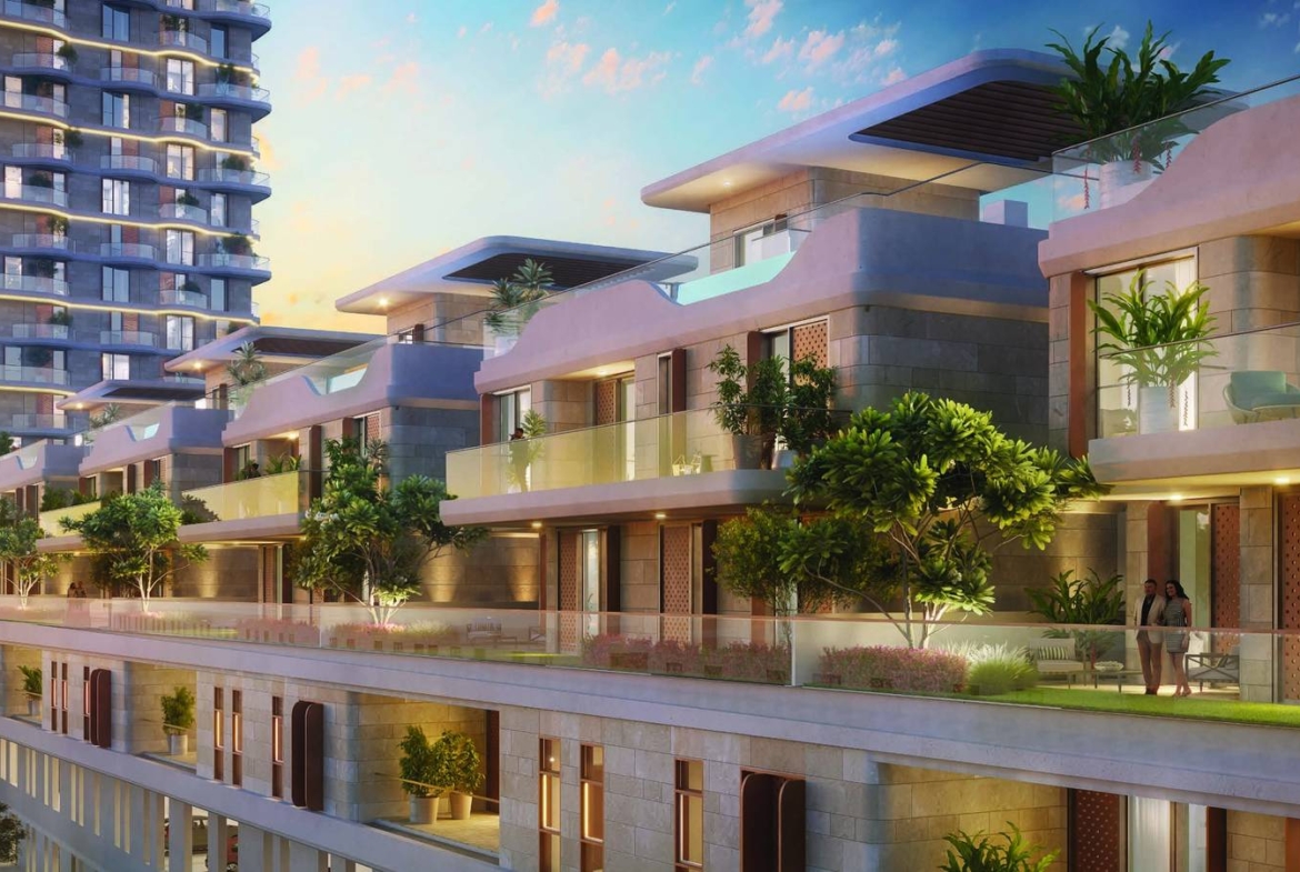 Takaya townhouses, villas and residential towers at dusk