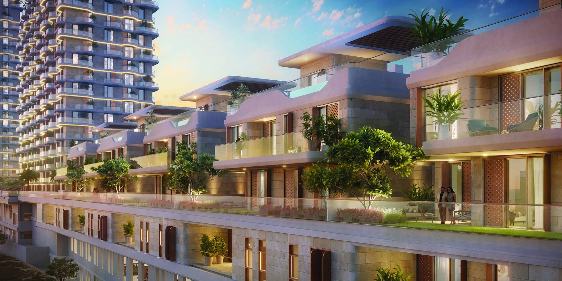 Takaya townhouses, villas and residential towers at dusk